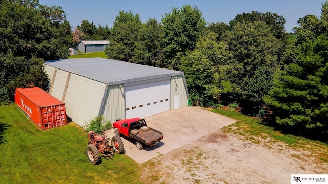 garage featuring a yard