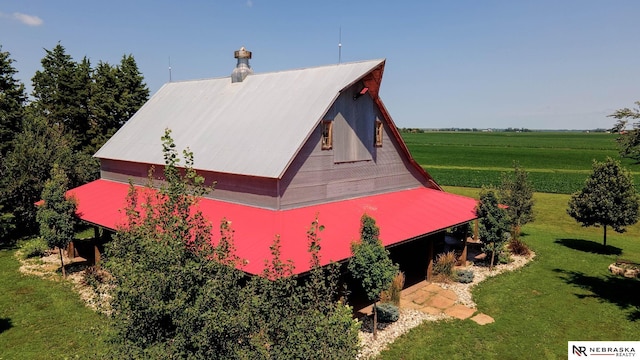 birds eye view of property featuring a rural view