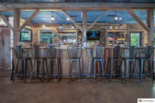 bar with concrete flooring