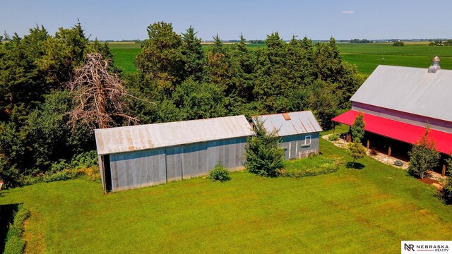 birds eye view of property with a rural view