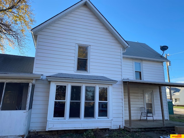 rear view of house with a deck