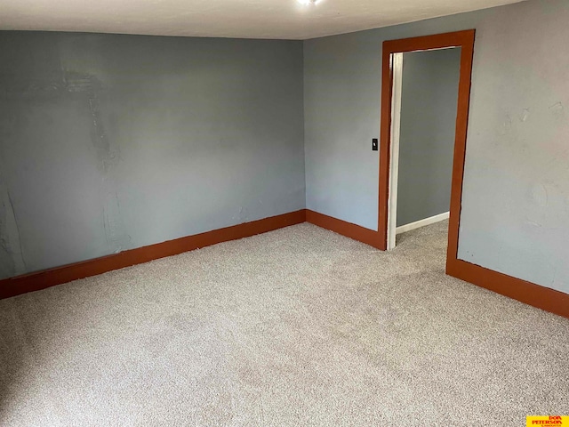 empty room with light colored carpet