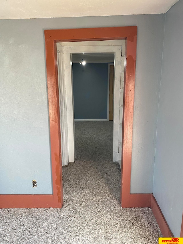 hallway with light colored carpet