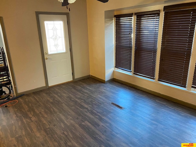 foyer entrance with dark hardwood / wood-style floors and ceiling fan