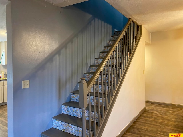 stairway with wood-type flooring