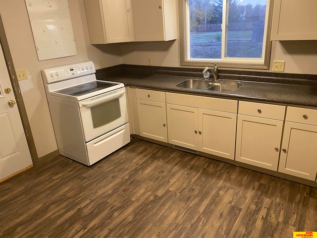 kitchen featuring white range with electric stovetop, dark hardwood / wood-style floors, white cabinetry, and sink