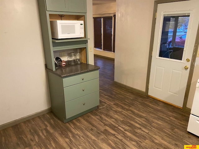 corridor featuring dark hardwood / wood-style flooring