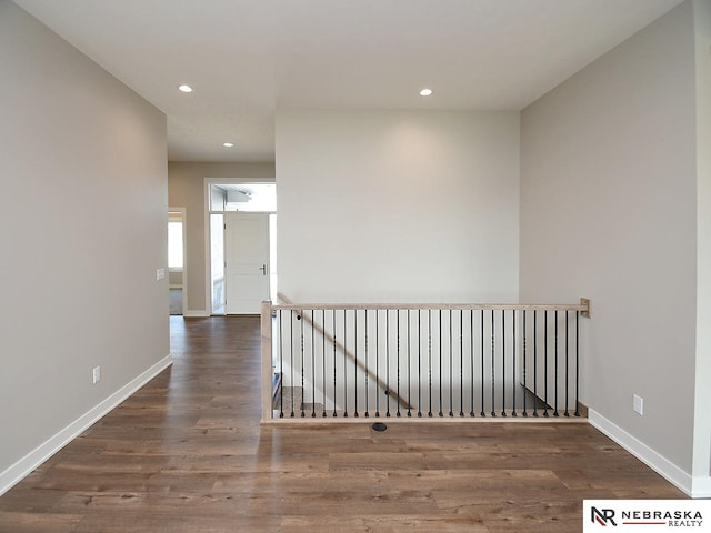 corridor with dark wood-type flooring