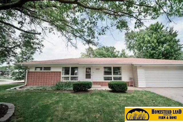 single story home with a garage and a front yard