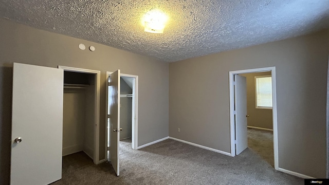 unfurnished bedroom with carpet and a textured ceiling