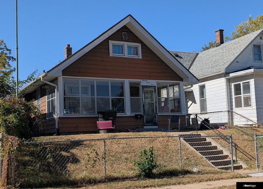 1944 S 11th St, Omaha, NE 68108 - bungalow-style house featuring a sunroom