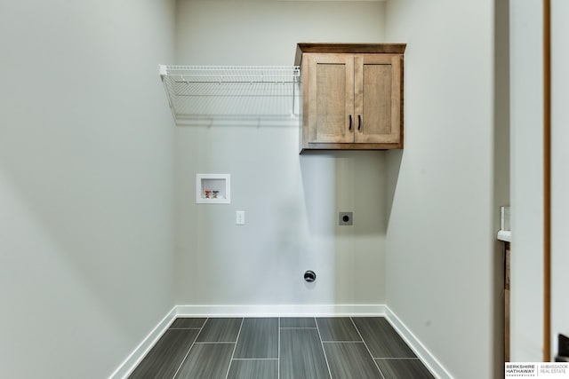 laundry area featuring washer hookup, hookup for an electric dryer, and cabinets