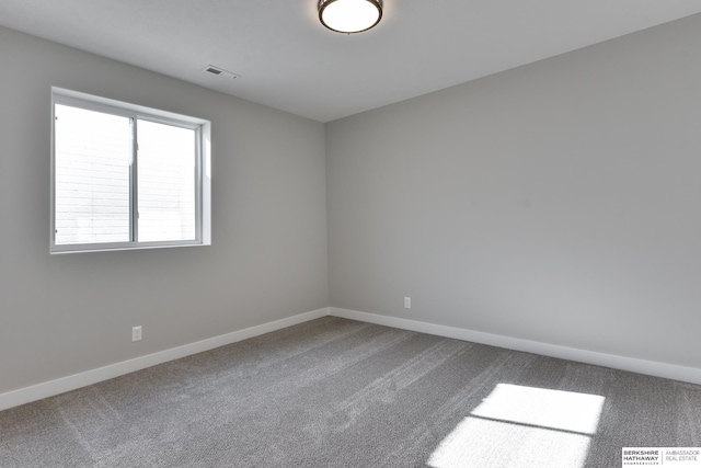 unfurnished room featuring carpet flooring