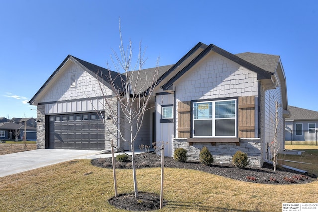 view of front of house featuring a front yard and a garage