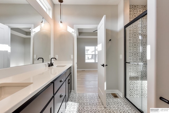 bathroom with vanity and hardwood / wood-style flooring