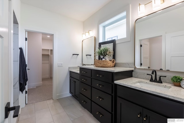 bathroom featuring tile patterned flooring and vanity