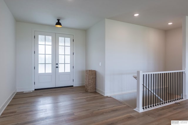 entryway featuring french doors and wood-type flooring