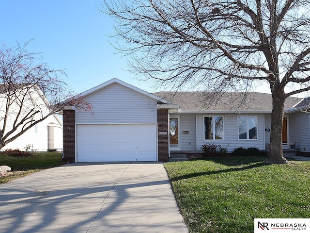 ranch-style house with a garage and a front lawn