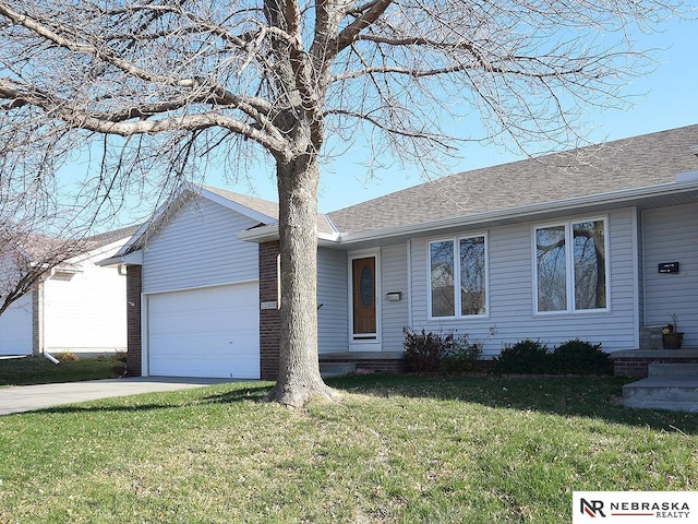 ranch-style home with a front yard and a garage