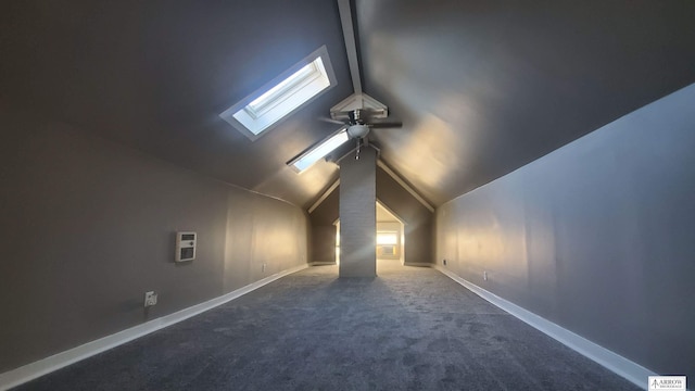 bonus room featuring vaulted ceiling with skylight, plenty of natural light, carpet flooring, and heating unit