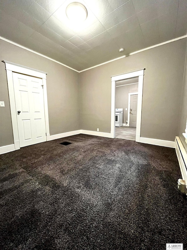 carpeted empty room with crown molding and a baseboard radiator