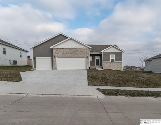 view of front of house with a front yard and a garage