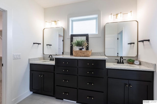 bathroom with tile patterned floors and vanity