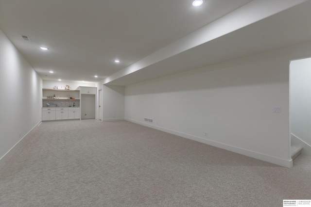 basement with carpet flooring