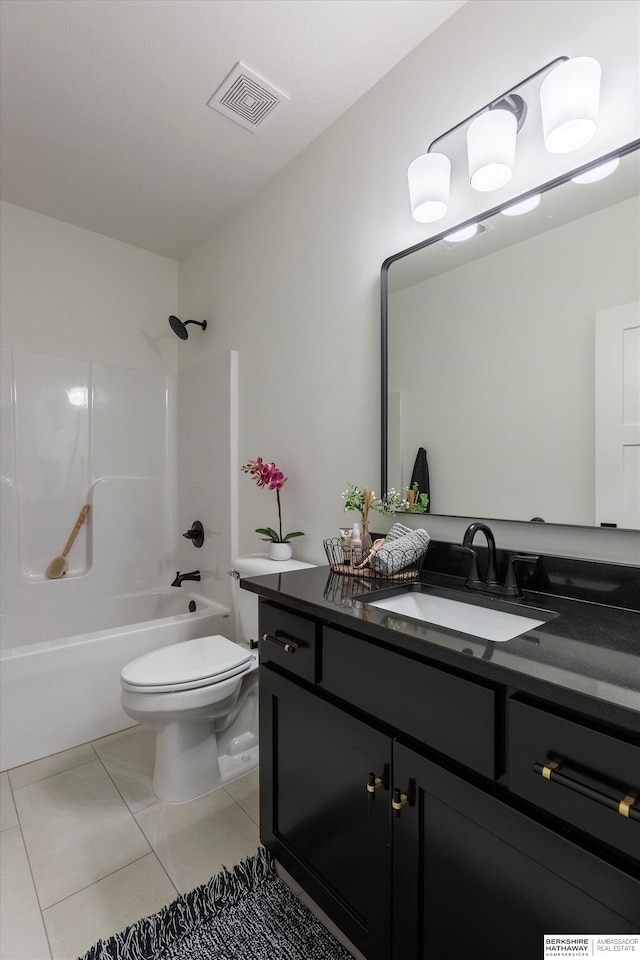 full bathroom featuring tile patterned floors, vanity, shower / bath combination, and toilet