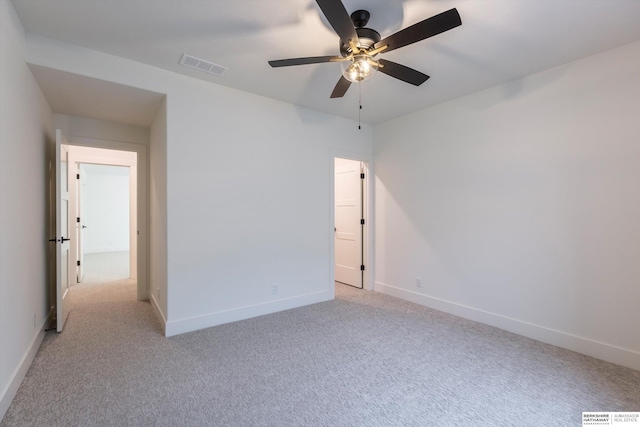 unfurnished bedroom featuring light colored carpet and ceiling fan