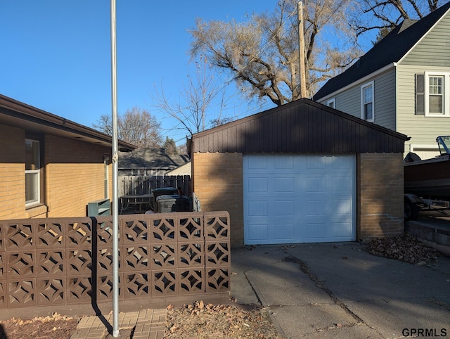 view of property exterior featuring a garage and an outbuilding