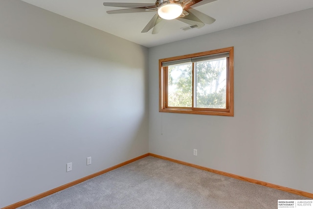 empty room with carpet floors and ceiling fan