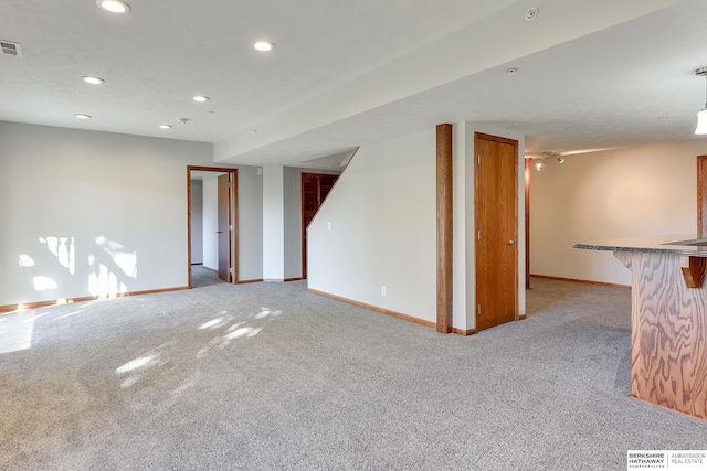 unfurnished room featuring light colored carpet