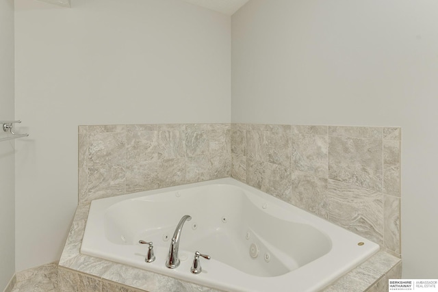 bathroom featuring a relaxing tiled tub