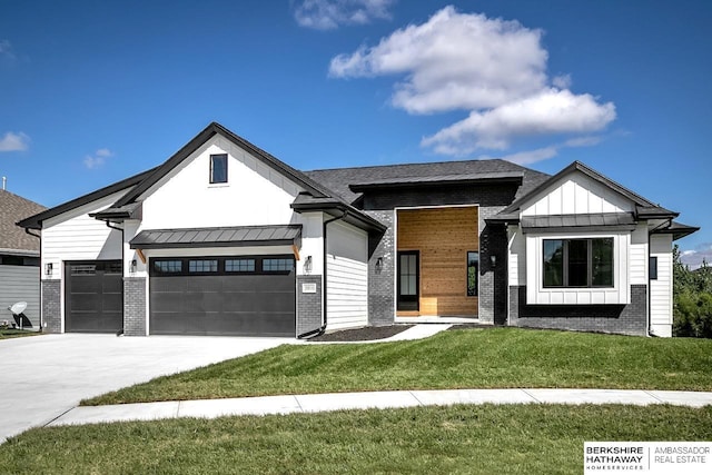 modern farmhouse style home featuring a garage and a front lawn