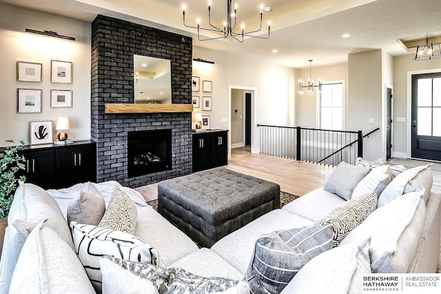 living room featuring a fireplace and light hardwood / wood-style flooring