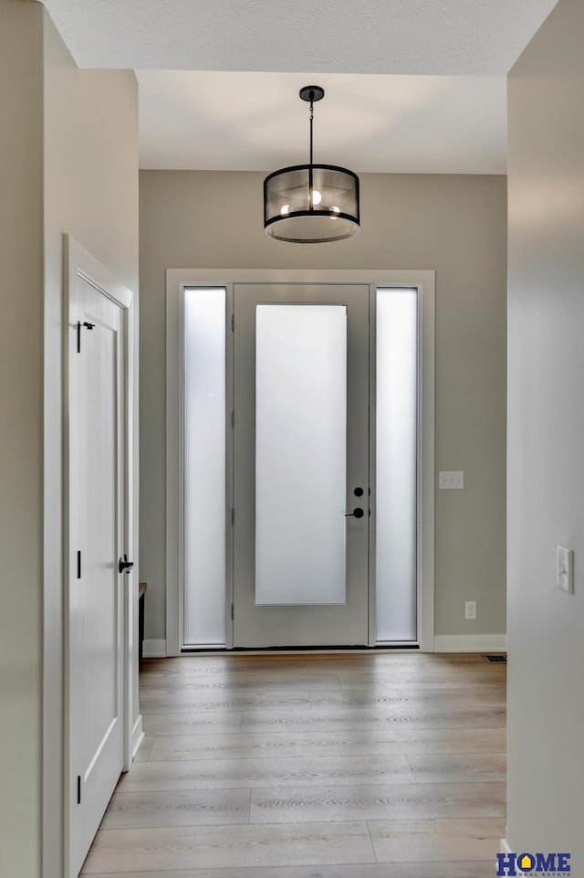 foyer featuring light wood-type flooring