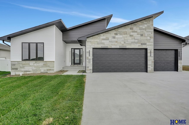 modern home with a front yard and a garage