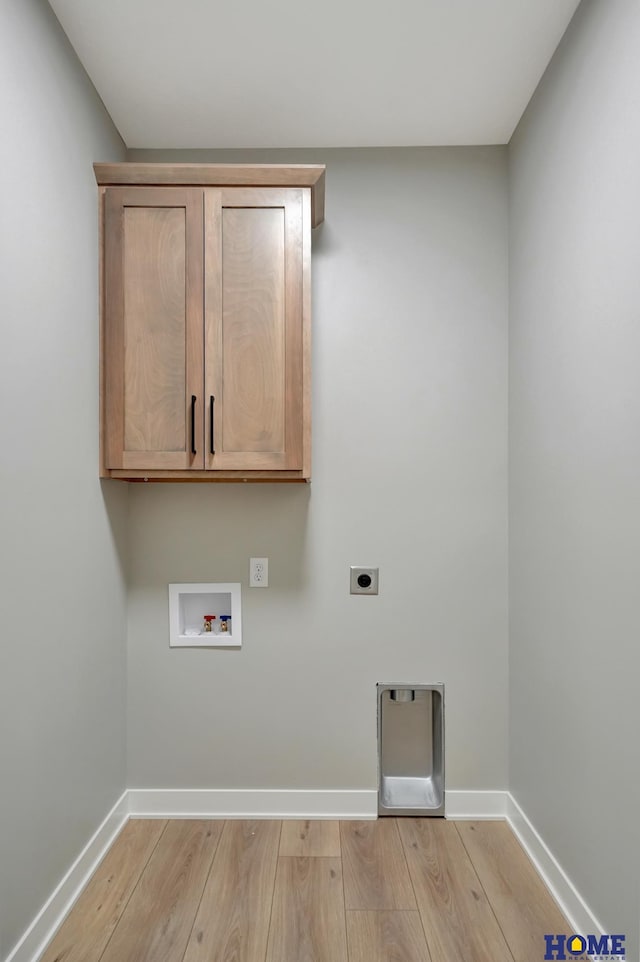 clothes washing area with electric dryer hookup, hookup for a washing machine, cabinets, and light wood-type flooring