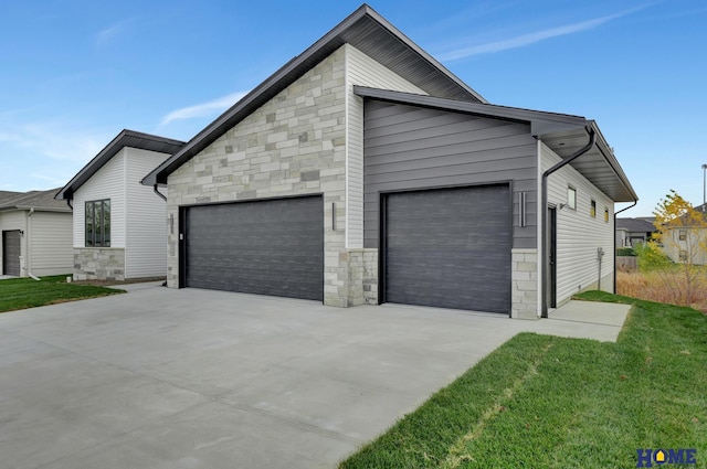 exterior space with a front lawn and a garage