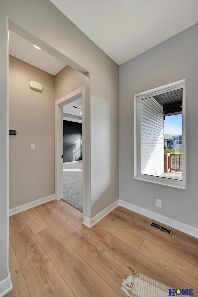 spare room featuring light hardwood / wood-style floors