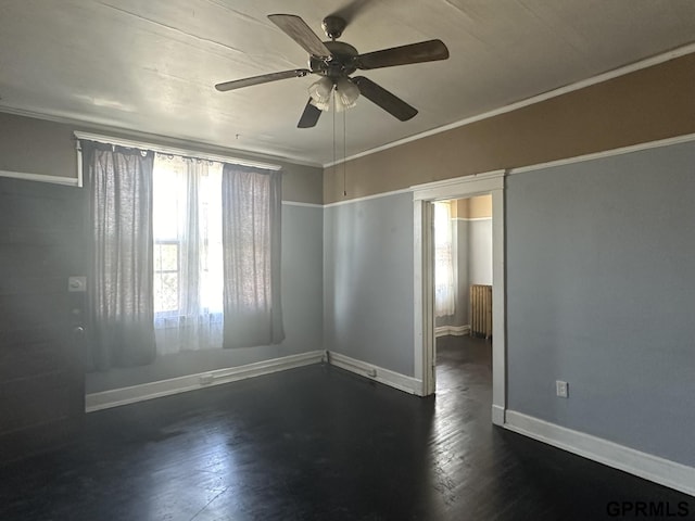 1424 4th Ave, Scottsbluff, NE 69361 - unfurnished room featuring radiator, dark hardwood / wood-style floors, ceiling fan, and crown molding