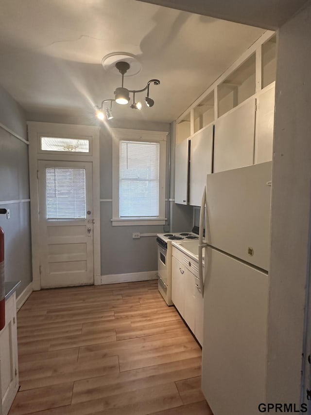 1424 4th Ave, Scottsbluff, NE 69361 - kitchen with white cabinets, light wood-type flooring, and white appliances