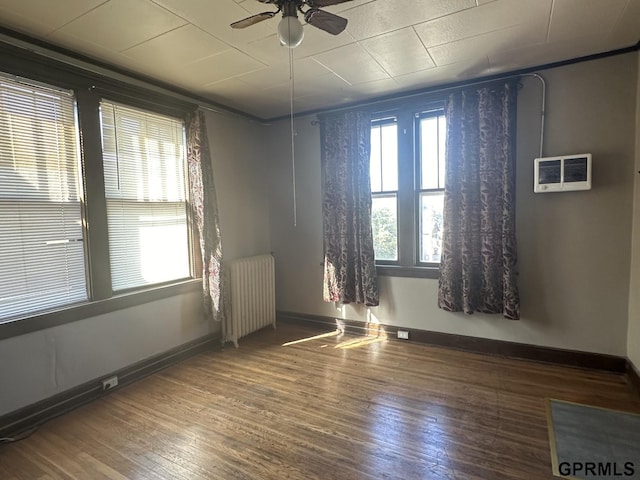 1424 4th Ave, Scottsbluff, NE 69361 - spare room with hardwood / wood-style flooring, radiator, and ceiling fan