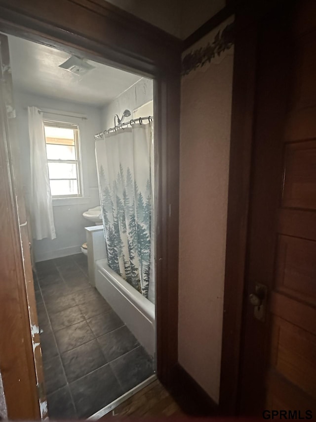 1424 4th Ave, Scottsbluff, NE 69361 - bathroom featuring shower / bath combo and toilet