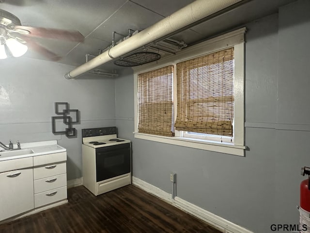 1424 4th Ave, Scottsbluff, NE 69361 - kitchen with ceiling fan, sink, dark wood-type flooring, white electric stove, and white cabinets