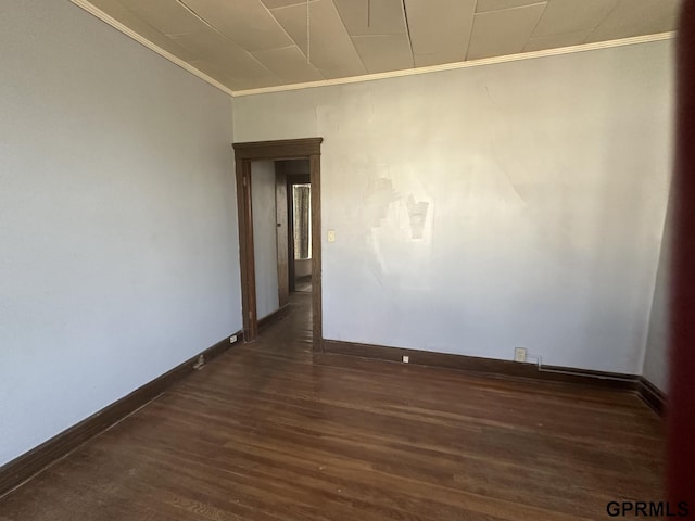 1424 4th Ave, Scottsbluff, NE 69361 - empty room featuring crown molding and dark hardwood / wood-style flooring