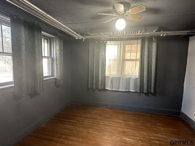 1424 4th Ave, Scottsbluff, NE 69361 - empty room with ceiling fan and wood-type flooring
