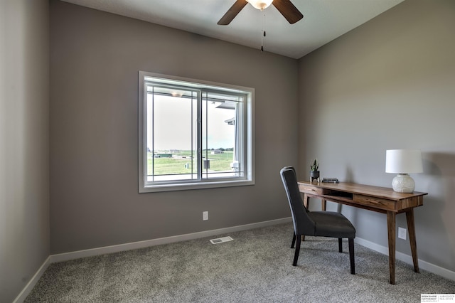 home office with light carpet and ceiling fan