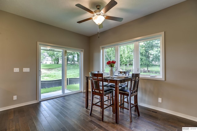 dining space featuring dark hardwood / wood-style flooring, a wealth of natural light, and ceiling fan